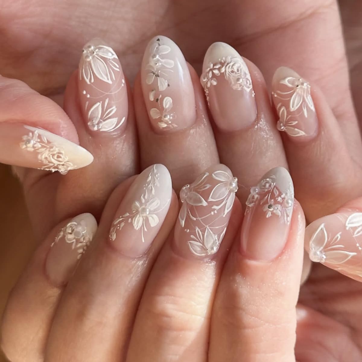 Spring bridal press-on nails with white floral details and French-inspired design