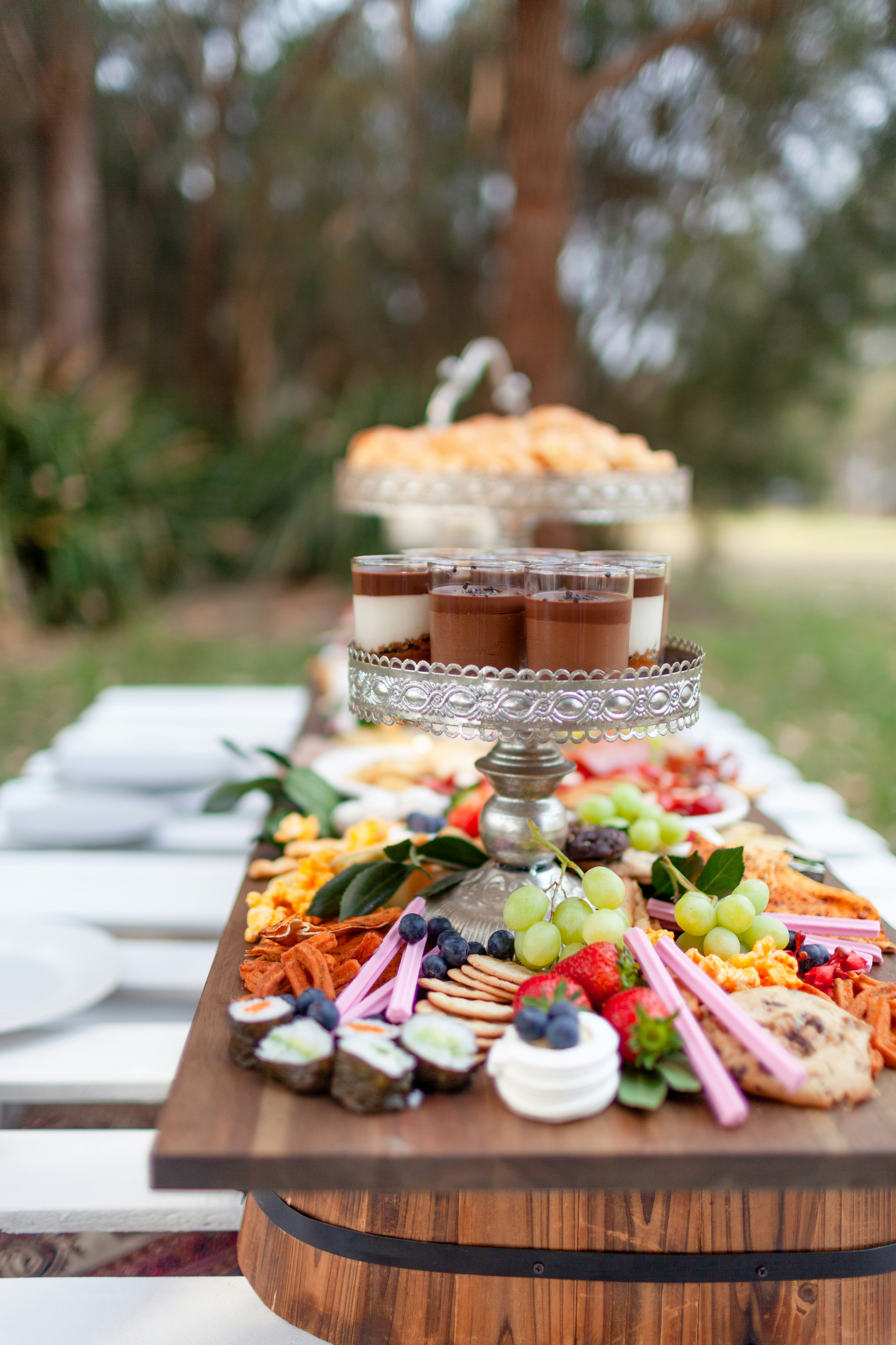 Elegant grazing table with cheeses, crackers, and fruit for a wedding