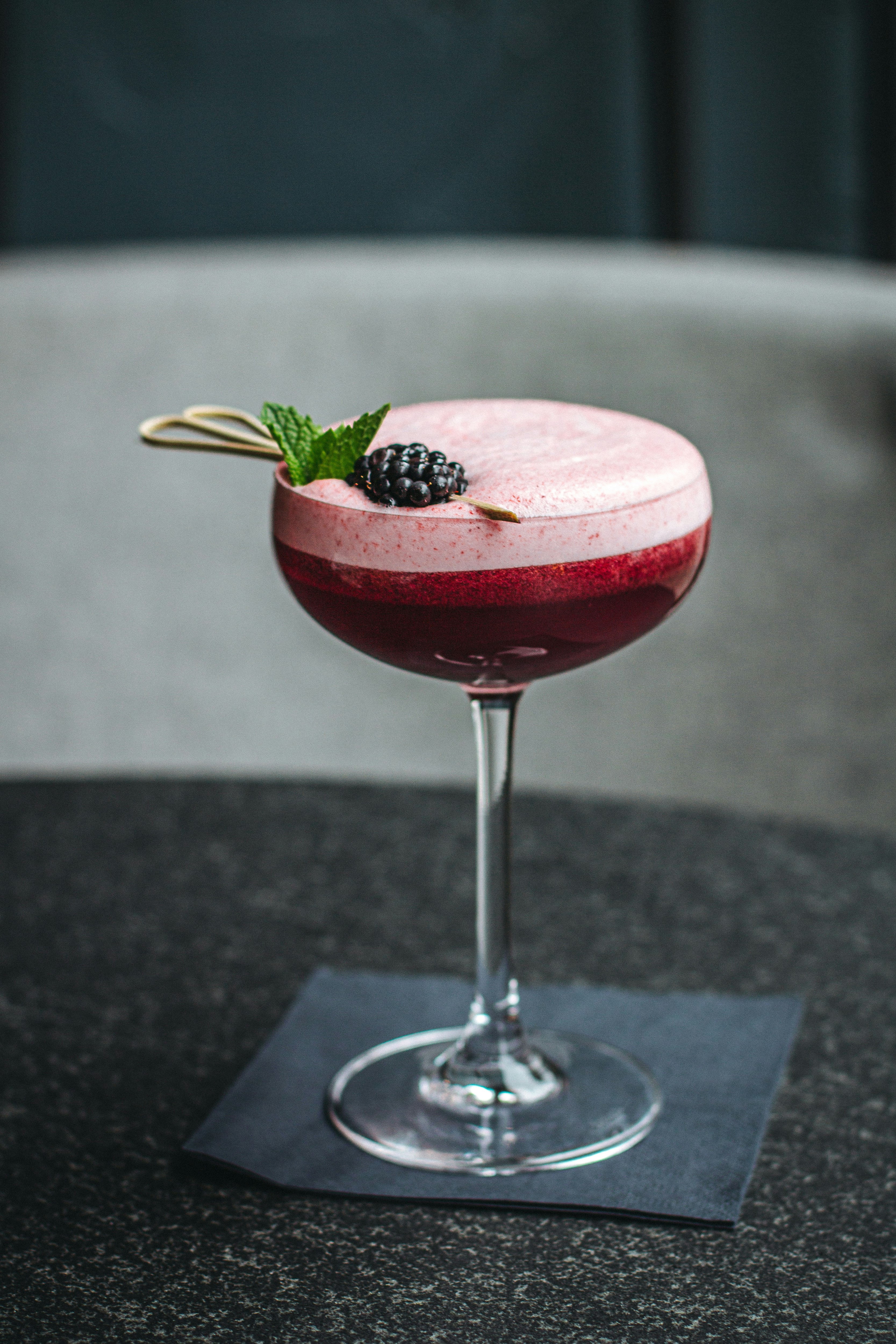 Elegant blackberry signature cocktail for a wedding